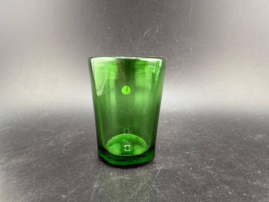 Filla John Glass Shot Glass - Green showcasing a handblown vibrant green design for stylish beverage enjoyment.