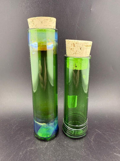 Filla John Glass Tall Nug Cork Jar - Green displayed alongside another tall green jar with cork lids.