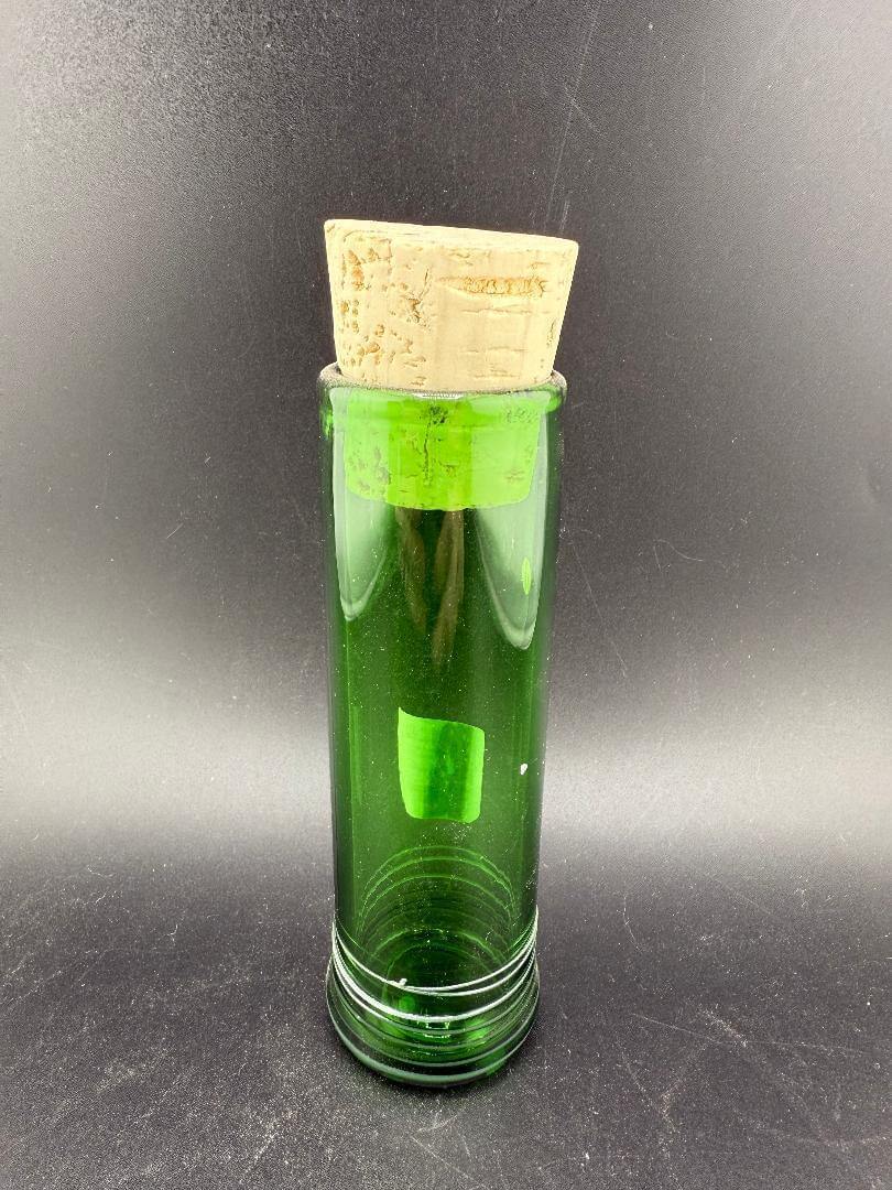 Filla John Glass Tall Nug Cork Jar - Green with a cork top against a dark background.