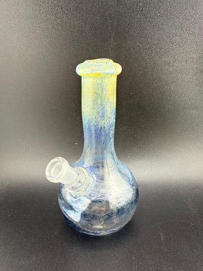 Filla John Mini Rig Wrap And Rake Beaker 10mm 45° showcasing vibrant mixed frit colors and unique design.