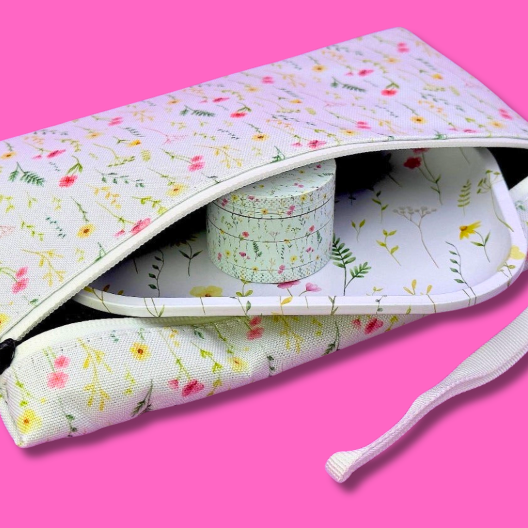 Coming Soon: Floral 3-in-1 Herb Set – Rolling Tray, Grinder & Travel Bag inside travel pouch with floral design.