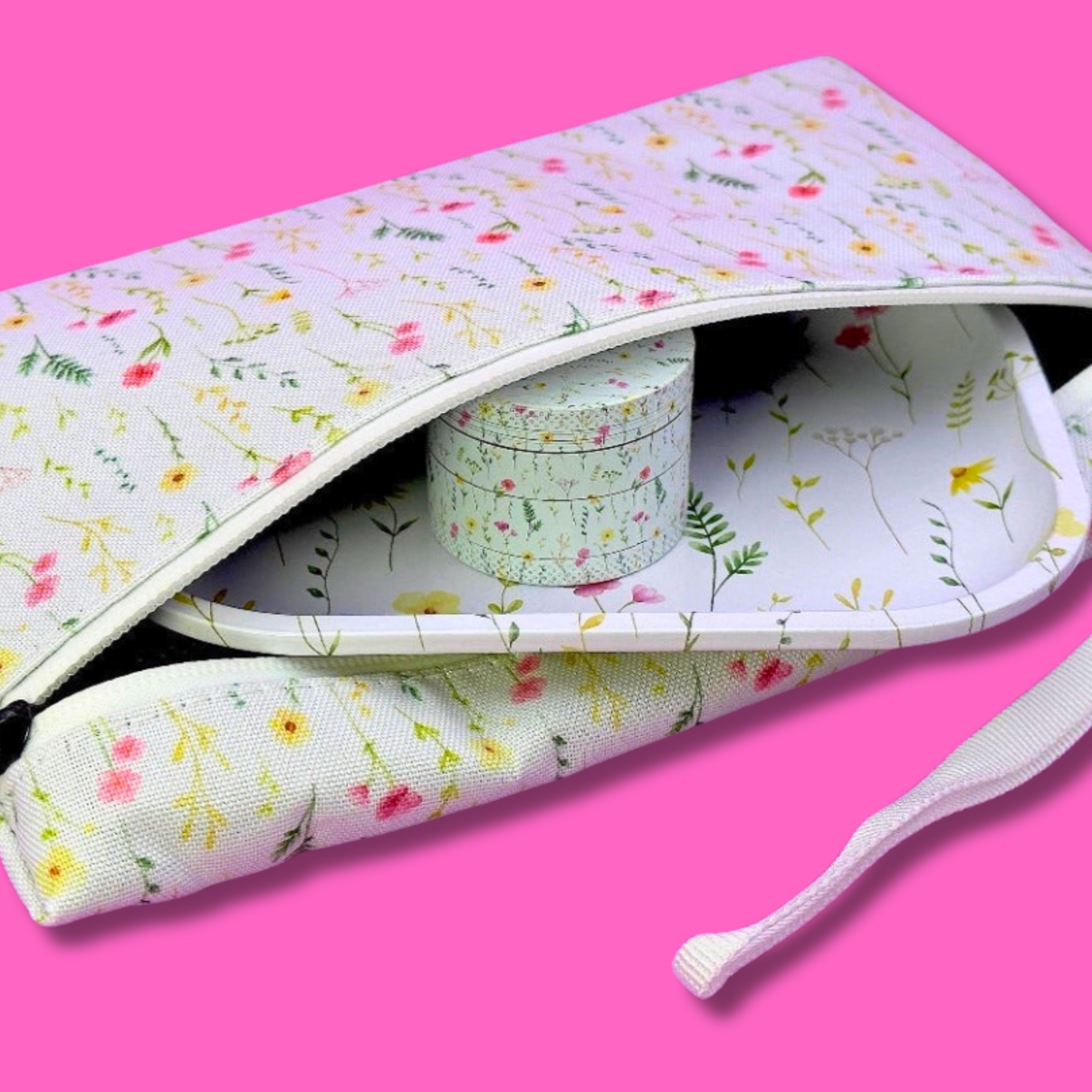 Coming Soon: Floral 3-in-1 Herb Set – Rolling Tray, Grinder & Travel Bag inside travel pouch with floral design.
