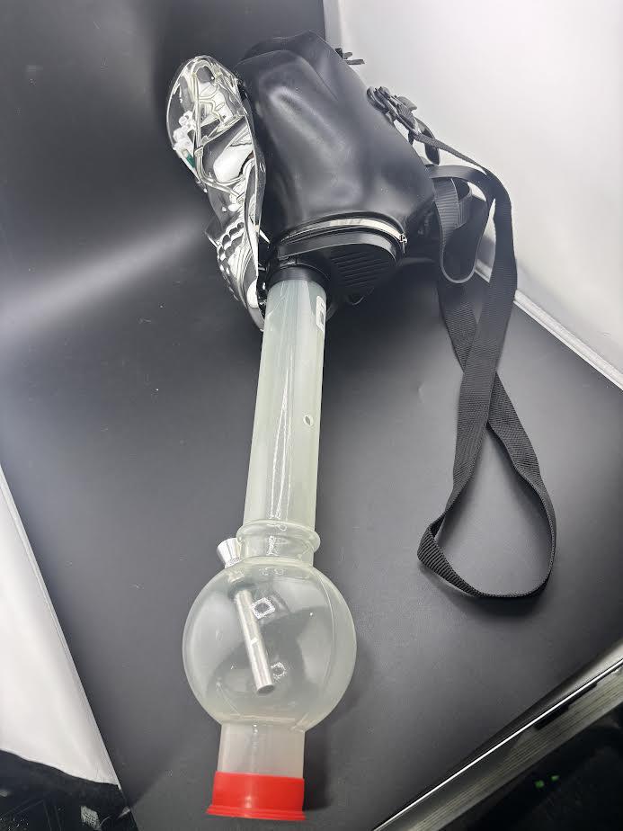 Gas Mask with Bong featuring a stylish design and functional plastic bong for ultimate party fun.