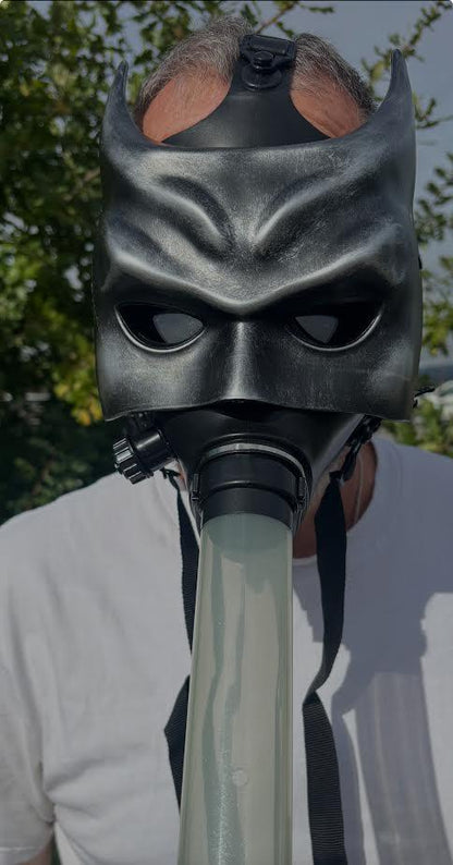 Gas Mask with Bong worn by a person outdoors, featuring a unique design that combines a mask and a bong for a fun party accessory.