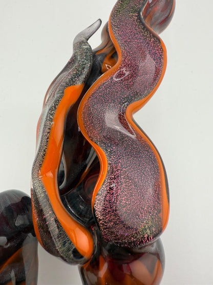Gemini Glass Dry Pipe in orange and steel wool colors, showcasing unique handcrafted designs and durable borosilicate glass.