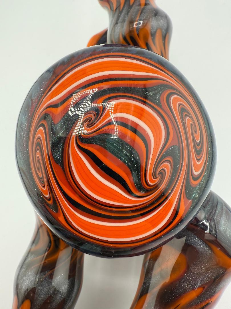 Gemini Glass Dry Pipe in orange and black swirl pattern, featuring durable American borosilicate craftsmanship.