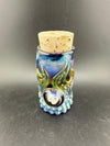 Glass Distractions Fumed Skull Cork Jar with intricate blue design and cork lid, showcasing artistry and unique color transitions.