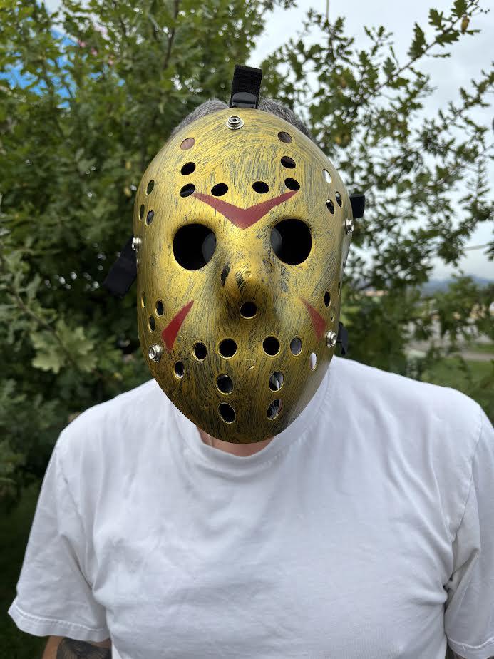 Gas Mask with Water Pipe displayed outdoors, featuring a bold design and functional elements for Halloween parties.