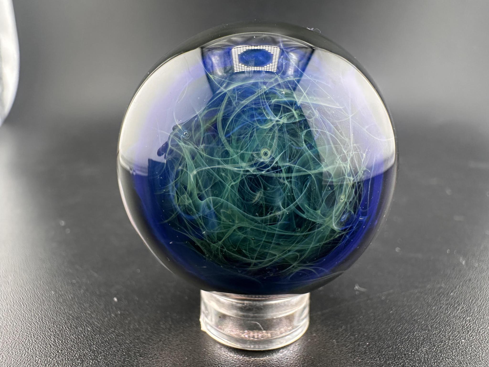 Guido Glass Marble - Chaos Backed Fumed Swirl showcasing swirling colors and depth in handcrafted design.