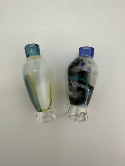 Two handcrafted glass pieces featuring vibrant colors and unique designs, showcasing artistic flair.