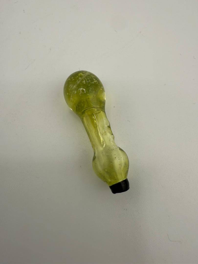 Unique yellow glass pipe on a white background, perfect for smoking enthusiasts and collectors.