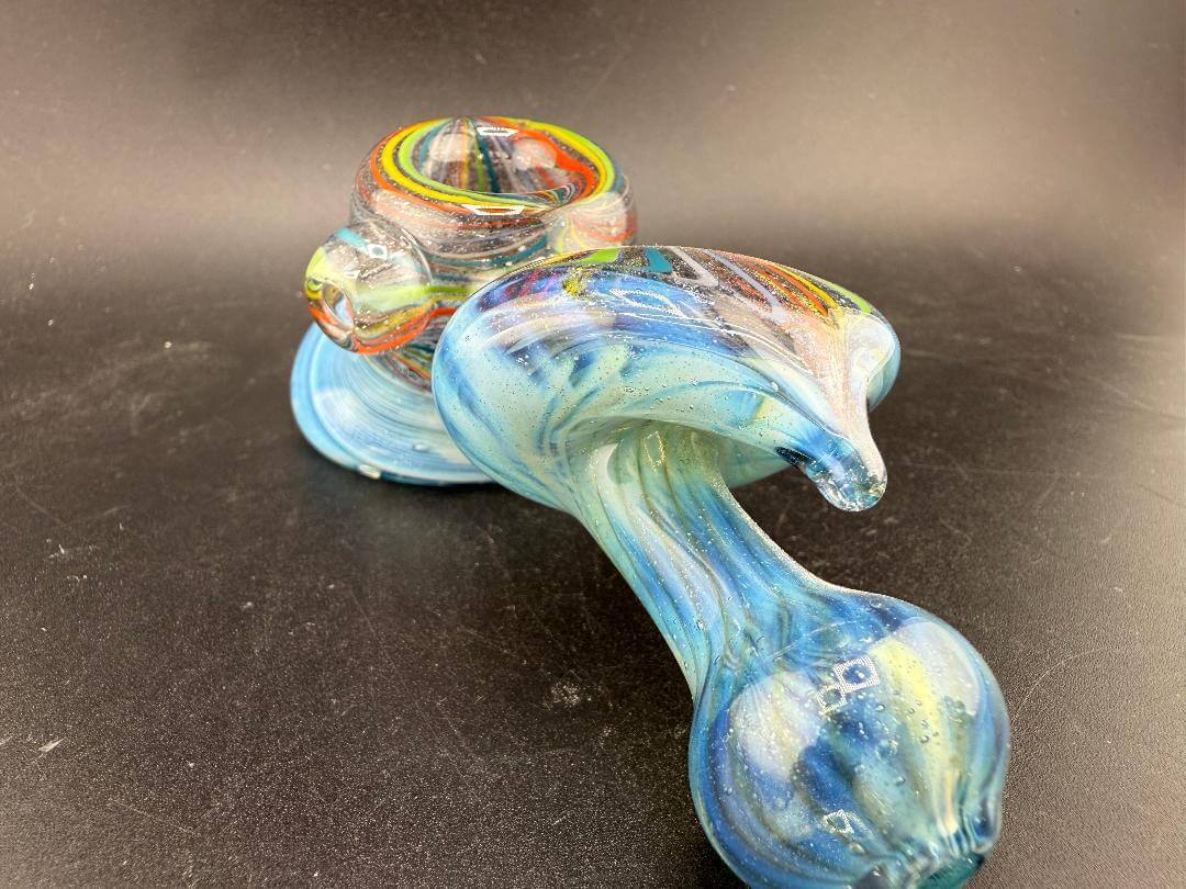 High Grade Glass Hammer Pipe - Light Blue w/ Rainbow  Line Worked Sections on a dark surface.