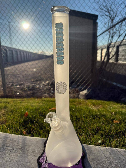 Highgrade Glass Flower Beaker - Sandblasted w/ Sacred Geometry Bake on 14mm 45° in natural outdoor setting.