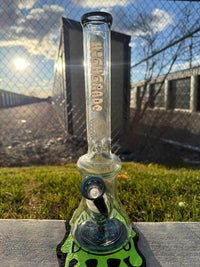 Highgrade Glass Flower Beaker - Wig Wag Reversal Bottom, Downstem, & Bowl 14mm 45° on grass with sunlight.
