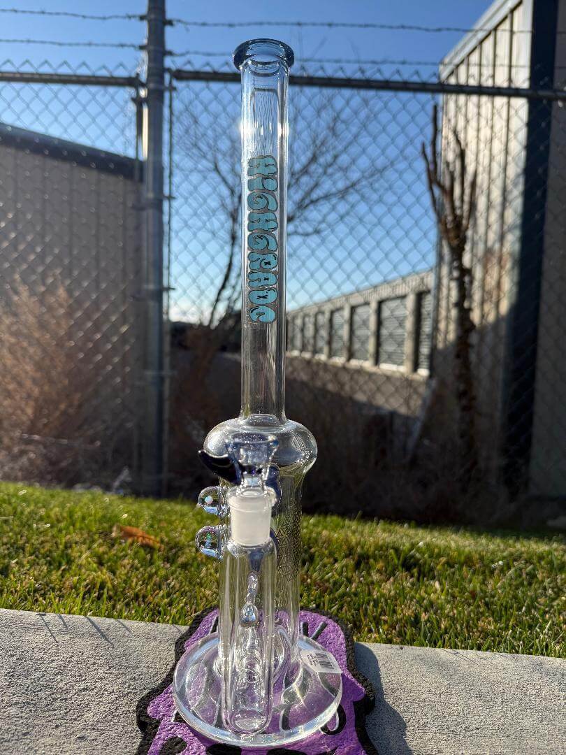 Highgrade Glass Flower Straight Tube - Blue Inline Perc w/ Filla Cello & Opal Attachments 14mm 90° displayed outdoors.
