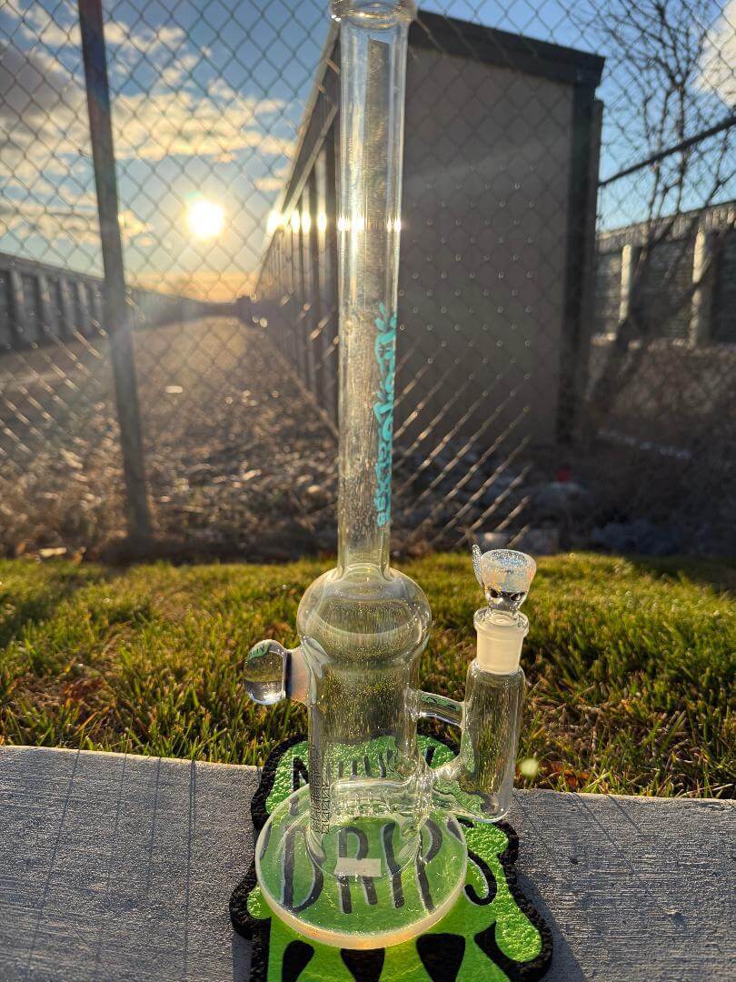 Highgrade Glass Flower Straight Tube - Color Accented Lip wraps w/ Inline Perc & Sacred Geometry Bake On 14mm 90° on display