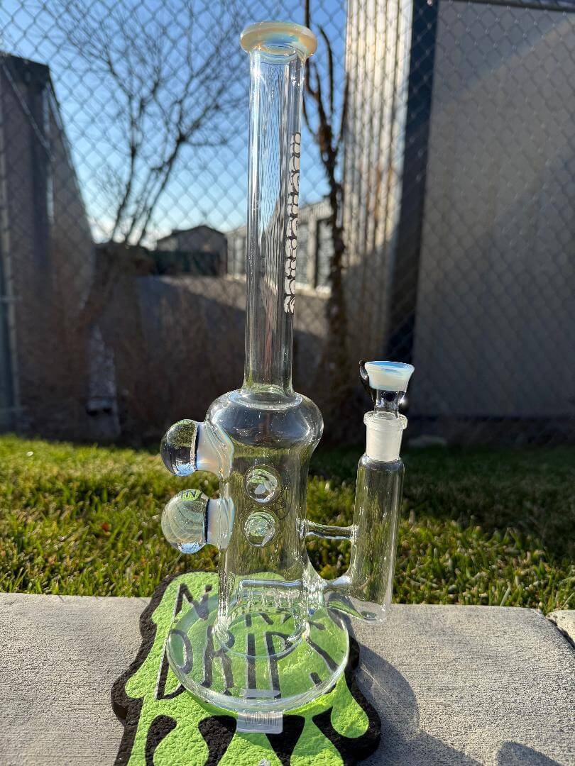 Highgrade Glass Flower Straight Tube - Opaline Inline Perc w/ Dichro, Fume Implosion  & Opal Attachments 14mm 90° displayed outdoors