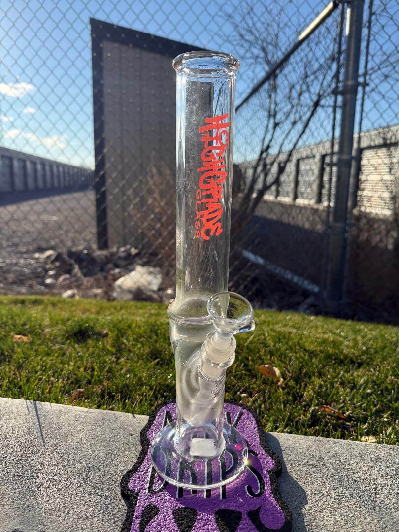 Highgrade Glass Flower Straight Tube - Pistol Loop Straight w/ Sacred Geometry Bake On 14mm 45° displayed outdoors