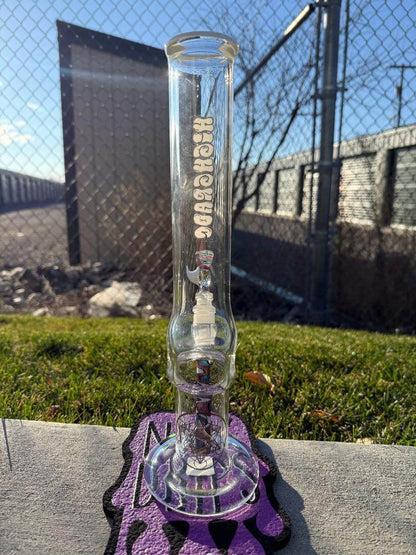 Highgrade Glass Flower Straight Tube – Red, White & Blue Wig Wag Color Accent Pistol Loop 14mm 45° displayed outdoors.