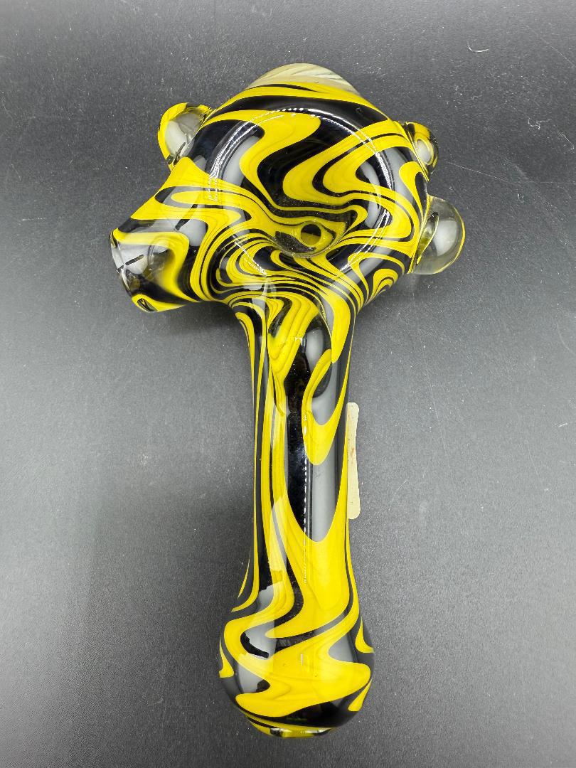 Highgrade Glass Hand Pipe - Black & Yellow Wig Wag showcasing bold contrast and heady craftsmanship.