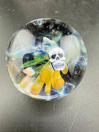 Highgrade Glass Marble - 38mm Skull Millie Implosion showcasing vibrant design and detailed craftsmanship.