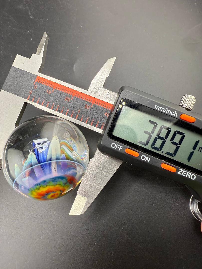 Highgrade Glass Marble - 38mm Skull Millie Implosion measured at 38.91mm with digital caliper.