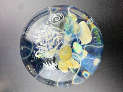 Highgrade Glass Marble - 40mm Millie Implosion w/ Opal Incasment showcasing a vibrant, multidimensional design.