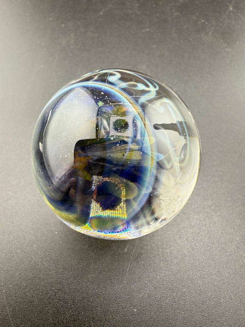 Highgrade Glass Marble - Fumed Implosion Apporx. 1.4" showcasing a colorful implosion effect.