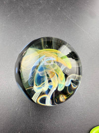 Highgrade Glass Marble - Fumed Implosion Approx. 1.4" showcasing colorful layered design and implosion effect.