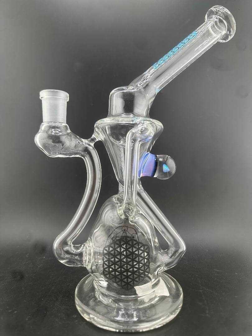 Highgrade Glass Recycler - Clear Rig Opal Marble Attachment & Sacred Geometry Bake ons 14mm 90° displayed in clear glass with intricate designs.