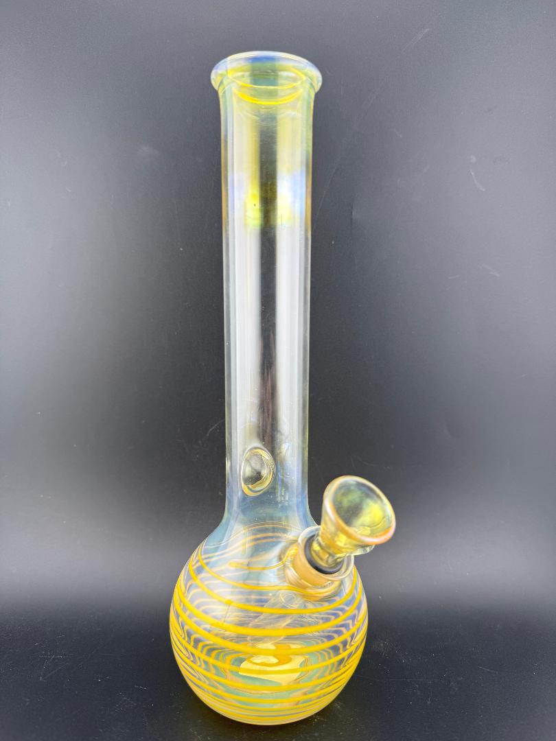 Highgrade Glass OG 9mm Tube Slide Gromit Fitting showcased in a stylish glass bong with yellow and transparent design.