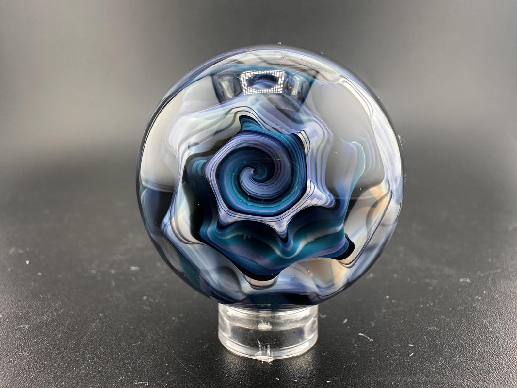 Highgrade Mike Glass Marble -Rising Ocean Swirl showcasing swirling oceanic blues and teals in handcrafted borosilicate glass.