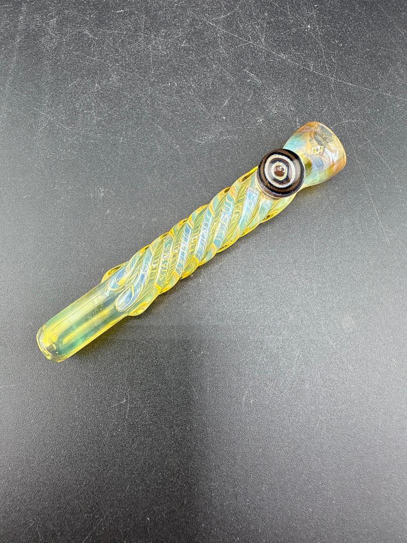 Home Blown Glass Chillum Pipe – Fumed & Twisted w/ Millie Accent on a black surface with a twisted design.