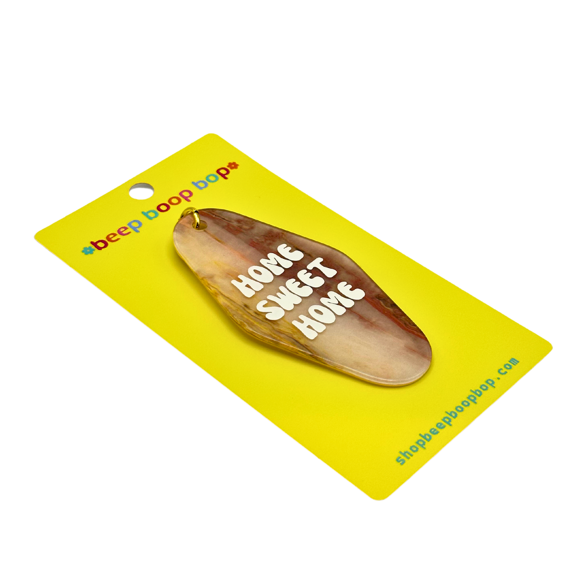 Home Sweet Home | Keychain displayed on a vibrant yellow card with playful branding.