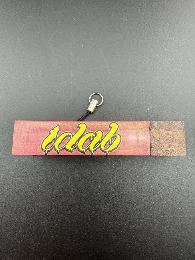 Idab Dabber Guard in vibrant red and yellow design, perfect for keeping dab tools neat and organized.