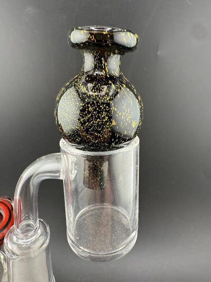 Import Bubble Cap 25mm - Dichro in black with gold accents for smooth airflow and optimal vaporization.