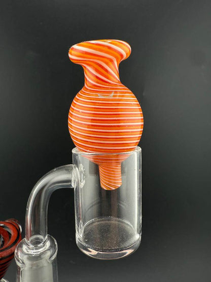 Import Bubble Cap 25mm - Line Worked in vibrant orange and red stripes, designed for flat-top quartz bangers.