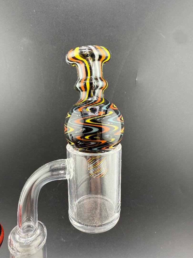 Import Bubble Cap 25mm - Wig Wag with vibrant linework for efficient vaporization on quartz bangers.