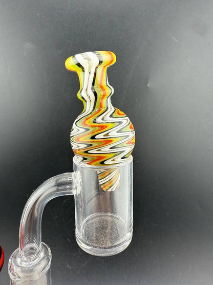 Import Bubble Cap 25mm - Wig Wag with vibrant Rasta colors for enhanced vaporization.