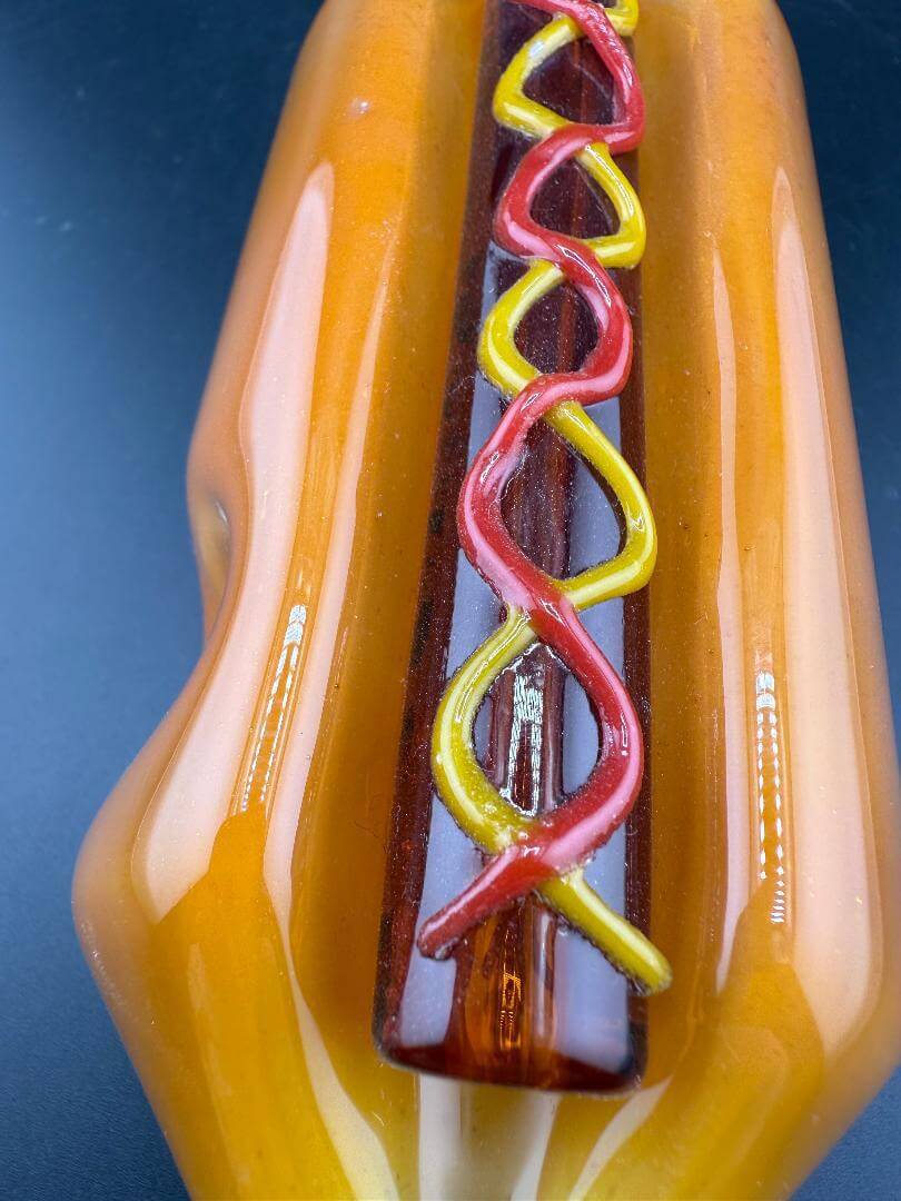 Import Glass Hand Pipe - Hotdog w/ Ketchup & Mustard featuring colorful ketchup and mustard accents.