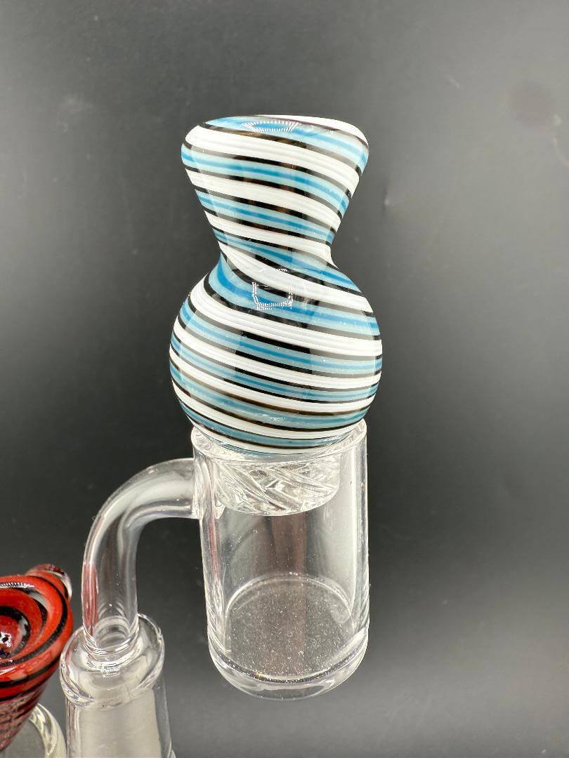 Import Glass Spinner Cap - Linework Swirl for 28mm Bangers on a quartz banger, showcasing stylish swirl design.