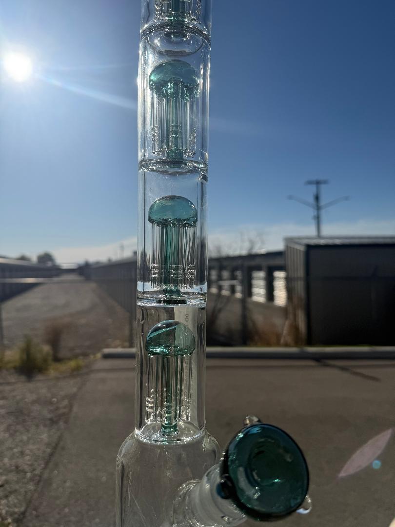 Import Quad Tree Perc Straight Tube 24" with quad tree percolator and green/teal accents against a clear blue sky.
