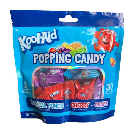 Kool-Aid Popping Candy pack featuring Tropical Punch, Cherry, and Grape flavors in colorful wrappers.