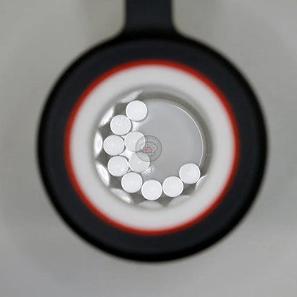 Ruby Pearl Co Terp Pearls – Ruby & Sapphire 3mm AAA Lab-Grown Gemstones (10-Pack) viewed through magnifying lens.