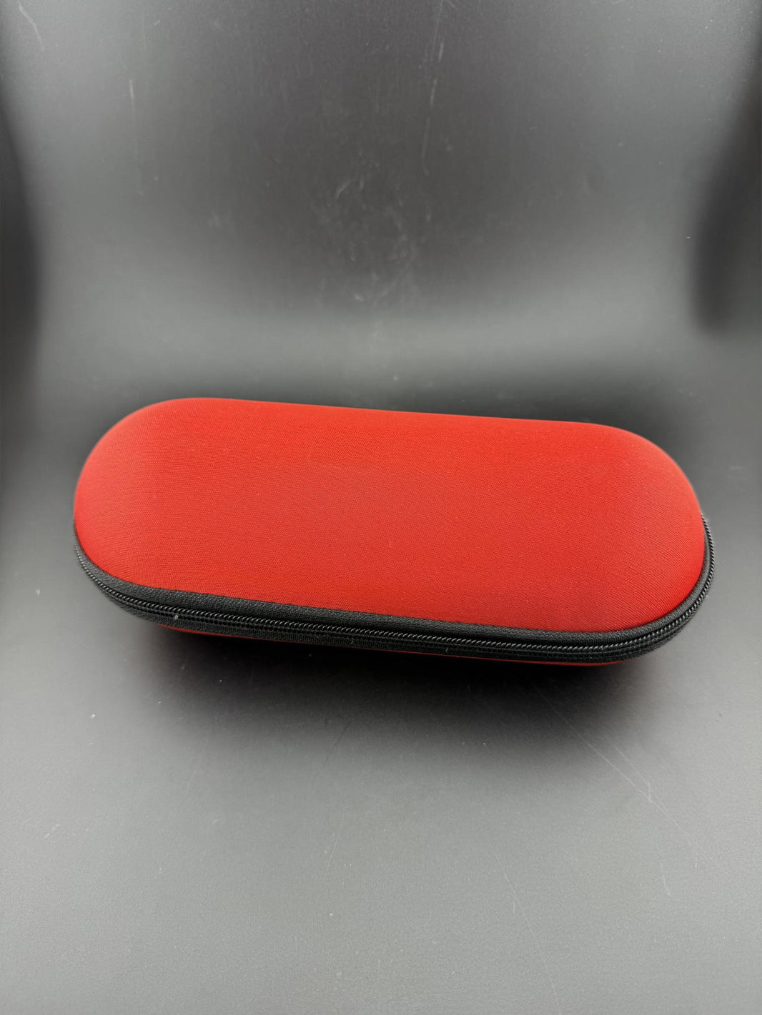Pipe Case - Large in red color, designed for protective storage of larger glass pieces like pipes and bubblers.