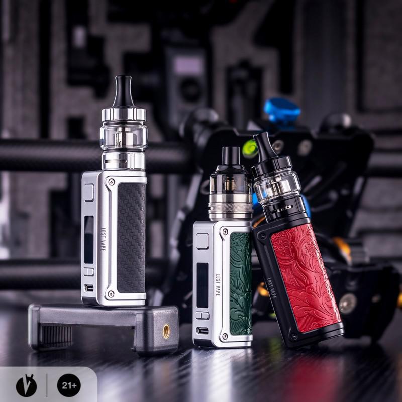 Lost Vape Thelema Mini 45W Kit w/ UB Lite Pod Tank in various colors on a desk.
