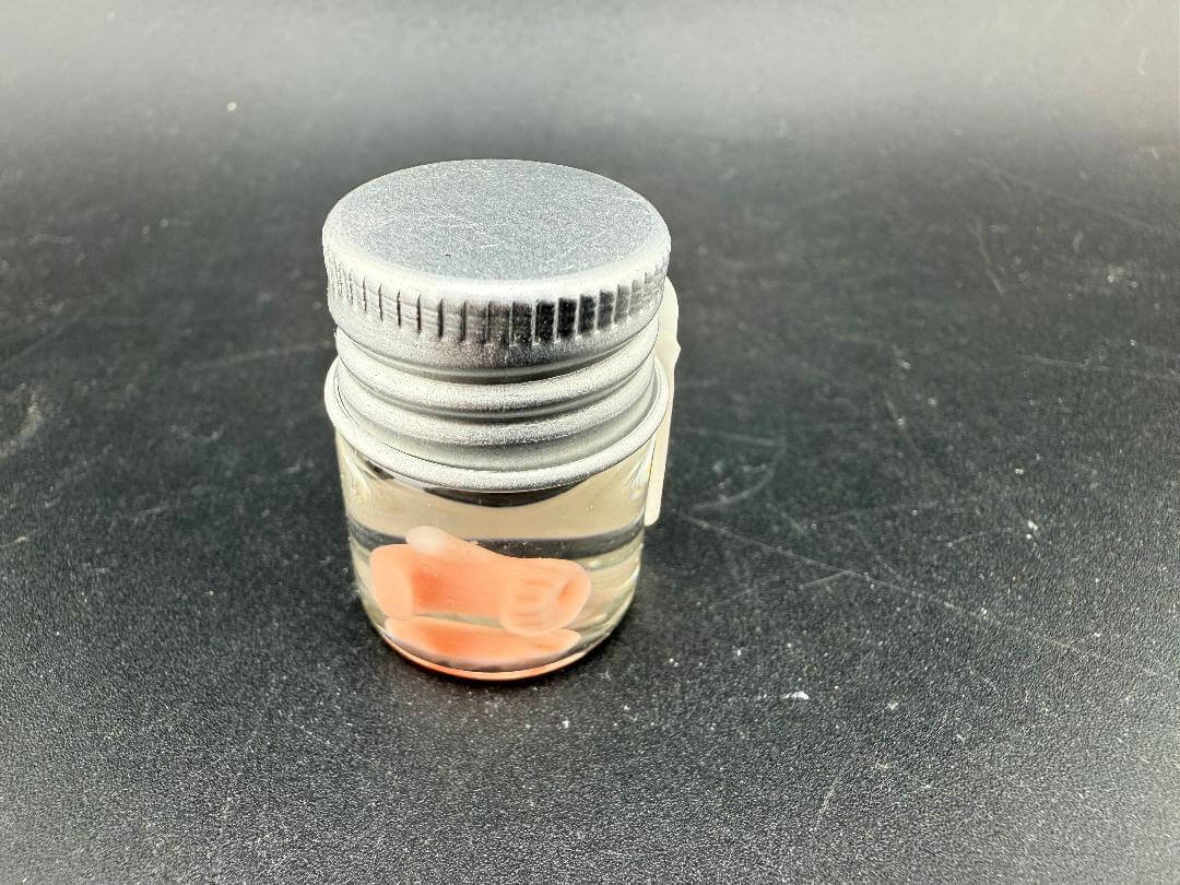 Lucky Gnome Glass Terp Pearl - Boxing glove in a clear jar with a silver lid.