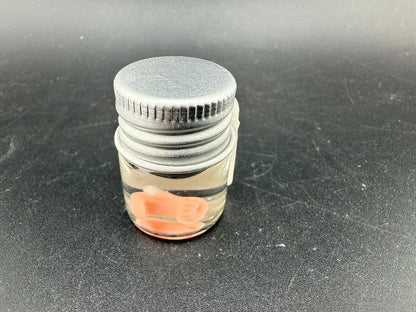 Lucky Gnome Glass Terp Pearl - Boxing glove in a clear jar with a silver lid.