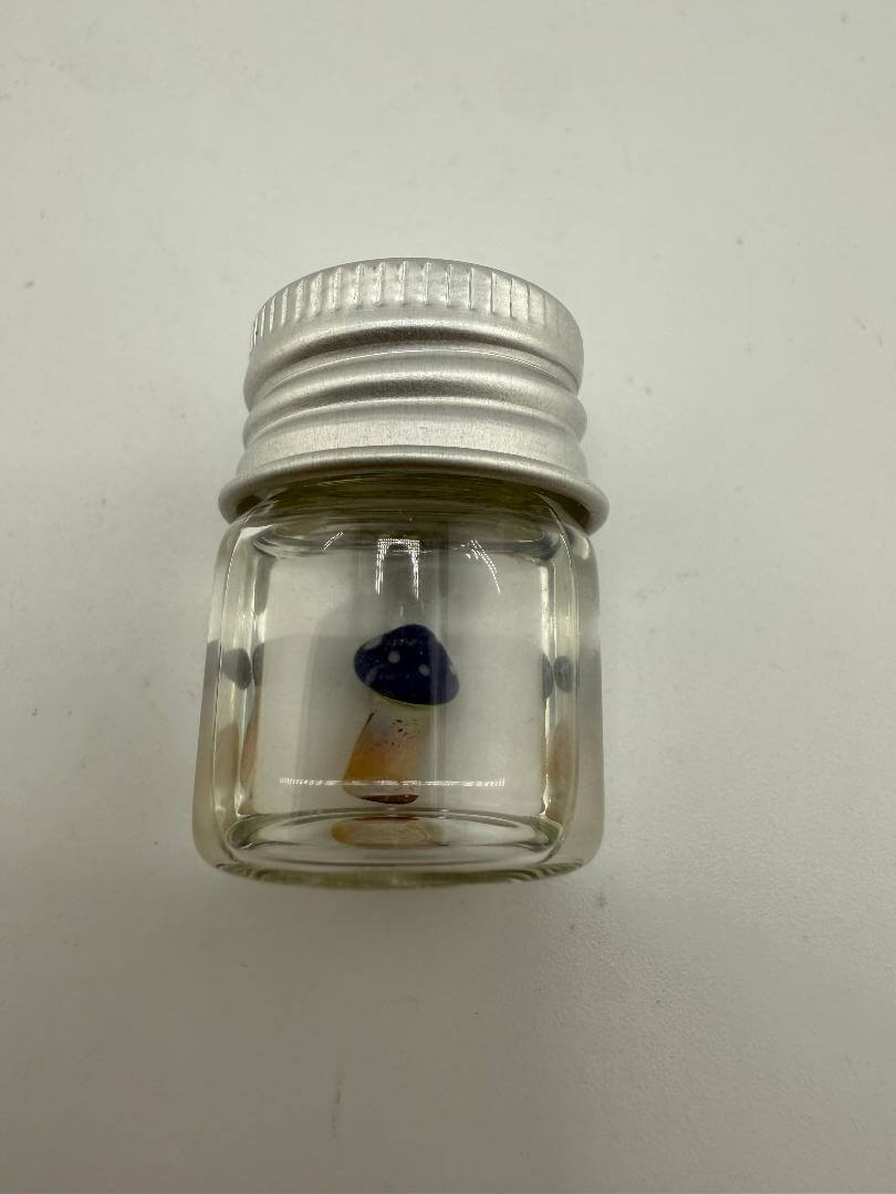 Lucky Gnome Glass Terp Pearl in jar, featuring a blue mushroom design, ideal for enhancing dab setups.