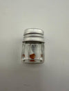 Lucky Gnome Glass Terp Pearl in a clear jar with a silver lid, showcasing unique mushroom design.